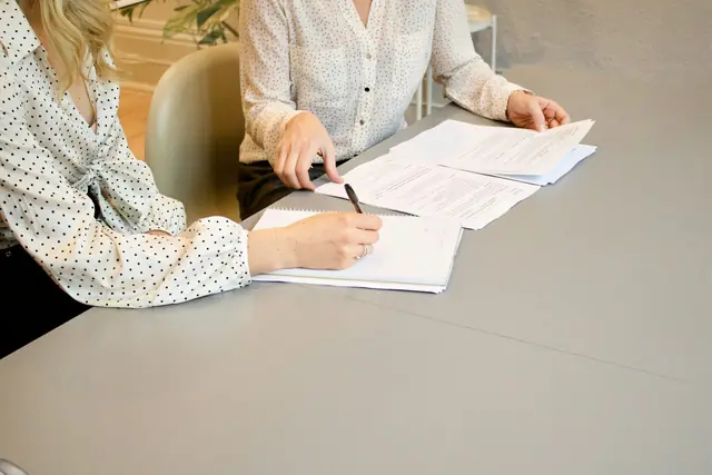 Lawyer and client reviewing documents at a table
